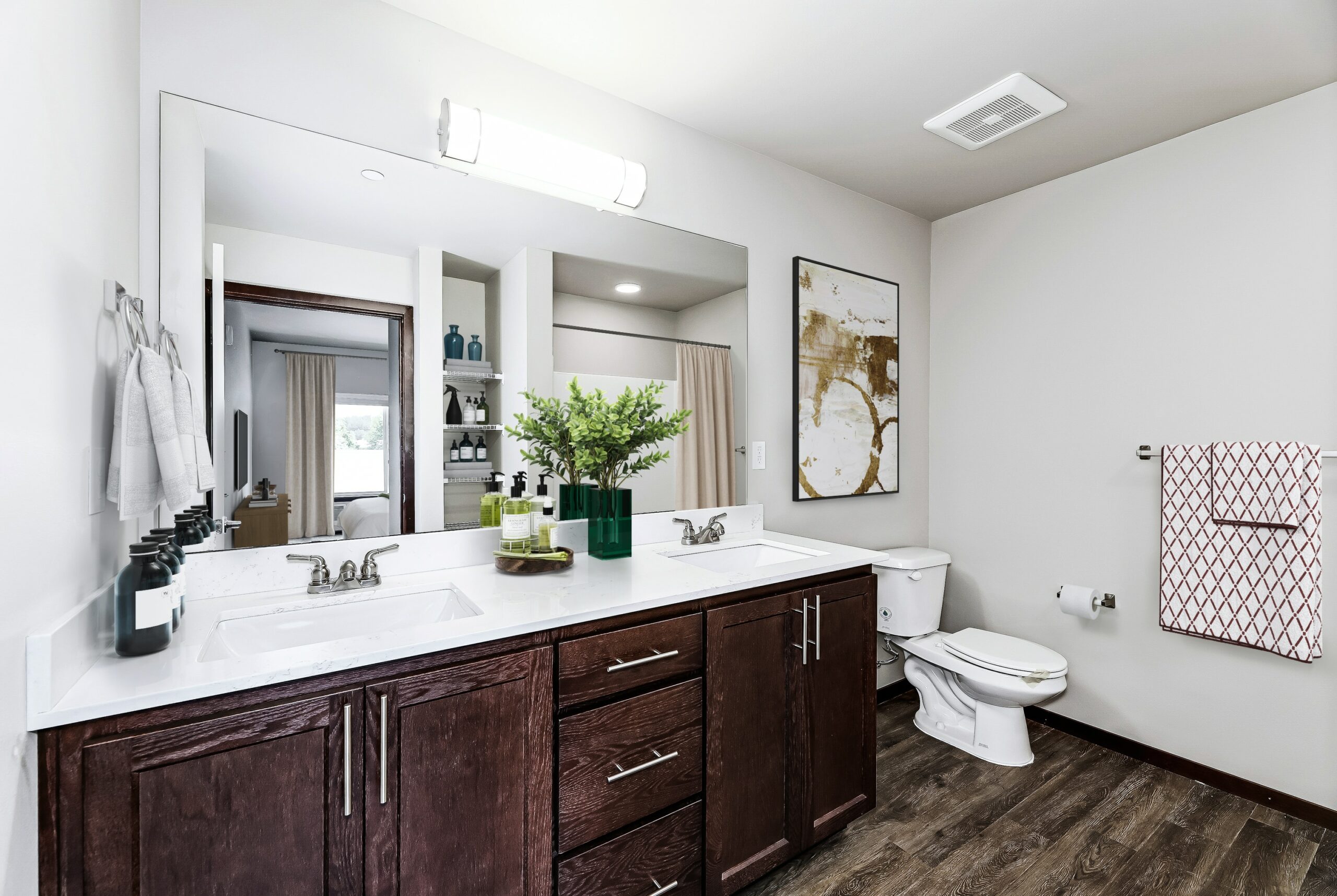 Two Bedroom Luxury Apartments in Arlington WA - Pilchuck Village - Bathroom with a Double Vanity, Quartz Countertops, and Connection to the Bedroom